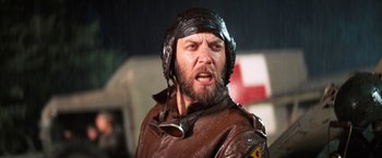 Movie still from “Kelly's Heroes” (1970), directed by Brian G. Hutton – A person wearing a helmet; Close Up shot, Low angle