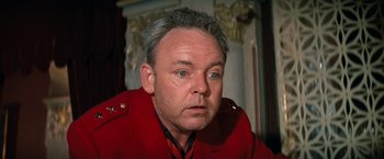 Movie still from “Kelly's Heroes” (1970), directed by Brian G. Hutton – A person wearing a red jacket; Close Up shot, Low angle