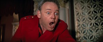 Movie still from “Kelly's Heroes” (1970), directed by Brian G. Hutton – A person wearing a red jacket; Close Up shot, Low angle