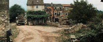 Movie still from “Kelly's Heroes” (1970), directed by Brian G. Hutton – An old building that has been demolished and torn down; Extreme Wide shot, High angle