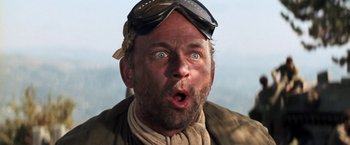 Movie still from “Kelly's Heroes” (1970), directed by Brian G. Hutton – A person wearing goggles and a jacket; Close Up shot, Low angle