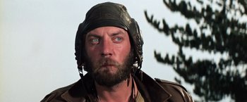 Movie still from “Kelly's Heroes” (1970), directed by Brian G. Hutton – A person wearing a helmet; Close Up shot, Low angle