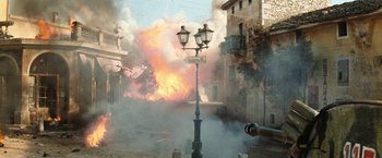 Movie still from “Kelly's Heroes” (1970), directed by Brian G. Hutton – A street light with a street sign on the corner of the street; Extreme Wide shot, High angle