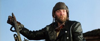 Movie still from “Kelly's Heroes” (1970), directed by Brian G. Hutton – A man in a leather jacket and a leather hat; Close Up shot, Low angle