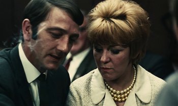 Movie still from “Kes” (1969), directed by Ken Loach – A man and a woman are looking at each other; Close Up shot, Low angle