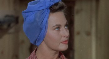 Movie still from “Kid Galahad” (1962), directed by Phil Karlson – A person wearing a headscarf; Close Up shot, Over the shoulder angle