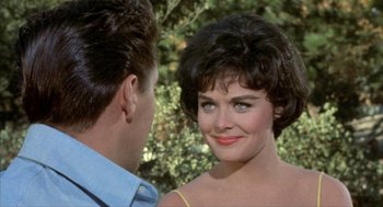 Movie still from “Kid Galahad” (1962), directed by Phil Karlson – A man and a woman looking at one another; Close Up shot, Over the shoulder angle