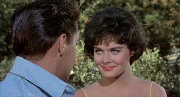 Movie still from “Kid Galahad” (1962), directed by Phil Karlson – A man and a woman looking at one another; Close Up shot, Over the shoulder angle