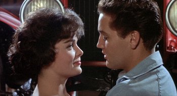 Movie still from “Kid Galahad” (1962), directed by Phil Karlson – A man and a woman looking at each other; Close Up shot, Low angle
