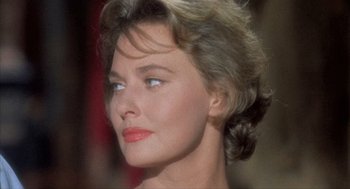 Movie still from “Kid Galahad” (1962), directed by Phil Karlson – A woman's face with a lot of makeup on her face; Close Up shot, Low angle