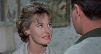 Movie still from “Kid Galahad” (1962), directed by Phil Karlson – A person wearing a necklace; Close Up shot, Over the shoulder angle