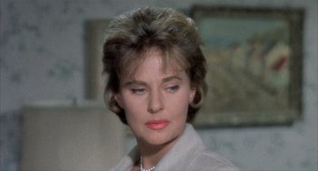 Movie still from “Kid Galahad” (1962), directed by Phil Karlson – A person wearing a necklace; Close Up shot, Over the shoulder angle