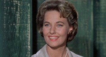 Movie still from “Kid Galahad” (1962), directed by Phil Karlson – A woman smiling for the camera; Close Up shot, Low angle