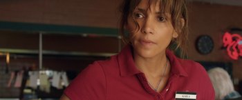 Movie still from “Kidnap” (2017), directed by Luis Prieto – A person wearing a red shirt; Close Up shot, Over the shoulder angle