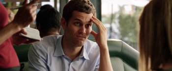 Movie still from “Kidnap” (2017), directed by Luis Prieto – A man sitting on a bus with his hand on his head; Close Up shot, Over the shoulder angle