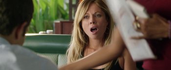 Movie still from “Kidnap” (2017), directed by Luis Prieto – A beautiful blonde haired woman sitting in a booth; Close Up shot, Over the shoulder angle