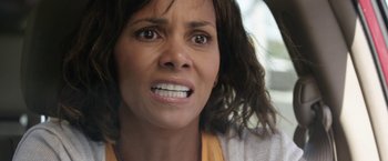 Movie still from “Kidnap” (2017), directed by Luis Prieto – A woman's face as she stares into the camera; Close Up shot, High angle