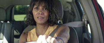 Movie still from “Kidnap” (2017), directed by Luis Prieto – A woman sitting in the driver's seat of a car; Close Up shot, High angle