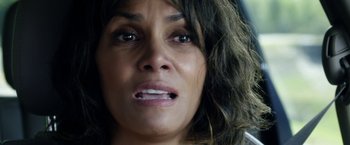 Movie still from “Kidnap” (2017), directed by Luis Prieto – A woman's face as she stares into the camera; Close Up shot, Overhead angle