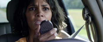 Movie still from “Kidnap” (2017), directed by Luis Prieto – A person in a car holding a cell phone; Close Up shot, Overhead angle