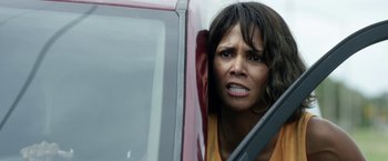 Movie still from “Kidnap” (2017), directed by Luis Prieto – A woman leaning out of the window of a car; Close Up shot, High angle