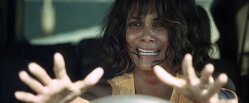 Movie still from “Kidnap” (2017), directed by Luis Prieto – A person with long brown hair; Close Up shot, Overhead angle