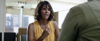 Movie still from “Kidnap” (2017), directed by Luis Prieto – A woman in a yellow dress looking at a mirror; Close Up shot, Over the shoulder angle