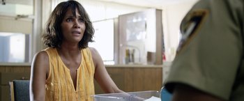 Movie still from “Kidnap” (2017), directed by Luis Prieto – A woman sitting at a table in front of a sink; Close Up shot, Over the shoulder angle