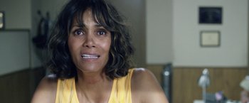Movie still from “Kidnap” (2017), directed by Luis Prieto – A woman in a yellow shirt is looking at the camera; Close Up shot, High angle