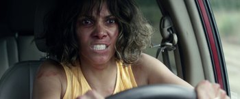 Movie still from “Kidnap” (2017), directed by Luis Prieto – A woman is driving in a car with her mouth wide open; Close Up shot, Overhead angle