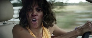 Movie still from “Kidnap” (2017), directed by Luis Prieto – A person sticking out her tongue; Close Up shot, Over the shoulder angle