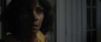 Movie still from “Kidnap” (2017), directed by Luis Prieto – A woman's face in a dark room; Close Up shot, Over the shoulder angle