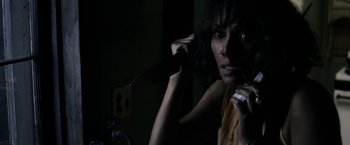 Movie still from “Kidnap” (2017), directed by Luis Prieto – A woman holding a knife in a dark room; Close Up shot, Over the shoulder angle