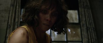 Movie still from “Kidnap” (2017), directed by Luis Prieto – A person wearing a yellow shirt; Close Up shot, Over the shoulder angle