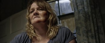 Movie still from “Kidnap” (2017), directed by Luis Prieto – A person with long blonde hair; Close Up shot, Over the shoulder angle