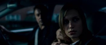 Movie still from “Kidulthood” (2006), directed by Menhaj Huda – A man and a woman in a dark room; Close Up shot, Over the shoulder angle