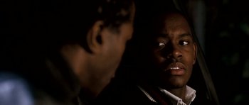 Movie still from “Kidulthood” (2006), directed by Menhaj Huda – Two men are talking in the dark; Close Up shot, Over the shoulder angle