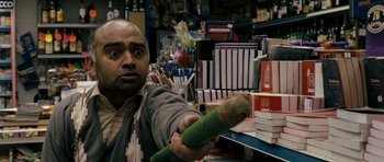 Movie still from “Kidulthood” (2006), directed by Menhaj Huda – A man is holding an object in his hand; Close Up shot, Over the shoulder angle
