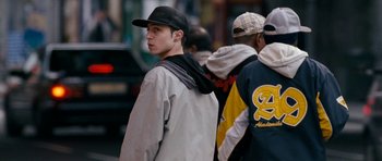 Movie still from “Kidulthood” (2006), directed by Menhaj Huda – A group of young men walking down a street; Medium shot, Over the shoulder angle