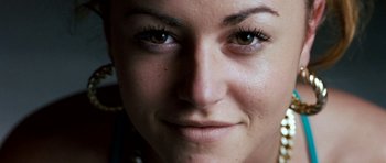 Movie still from “Kidulthood” (2006), directed by Menhaj Huda – A woman's face with green eyes; Extreme Close Up shot, Overhead angle