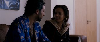 Movie still from “Kidulthood” (2006), directed by Menhaj Huda – A man and a woman sitting next to each other; Close Up shot, Over the shoulder angle
