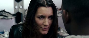 Movie still from “Kidulthood” (2006), directed by Menhaj Huda – A person with long black hair; Close Up shot, Over the shoulder angle