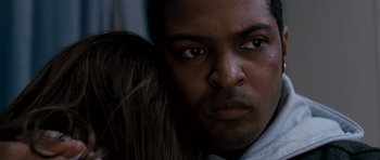 Movie still from “Kidulthood” (2006), directed by Menhaj Huda – A person holding a person's face; Close Up shot, Over the shoulder angle
