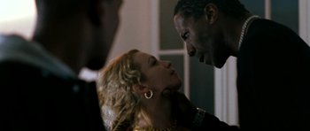 Movie still from “Kidulthood” (2006), directed by Menhaj Huda – A man and a woman face to face in a room; Close Up shot, Over the shoulder angle