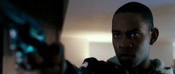 Movie still from “Kidulthood” (2006), directed by Menhaj Huda – A person holding a cell phone; Close Up shot, Low angle