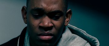 Movie still from “Kidulthood” (2006), directed by Menhaj Huda – A person with his eyes wide open; Extreme Close Up shot, Low angle
