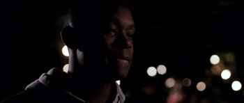 Movie still from “Kidulthood” (2006), directed by Menhaj Huda – A person looking at the camera; Close Up shot, Low angle