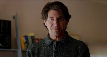 Movie still from “Kika” (1993), directed by Pedro Almodóvar – A person with long hair; Close Up shot, Over the shoulder angle