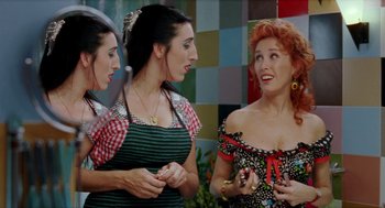 Movie still from “Kika” (1993), directed by Pedro Almodóvar – A group of women standing next to each other; Close Up shot, Over the shoulder angle
