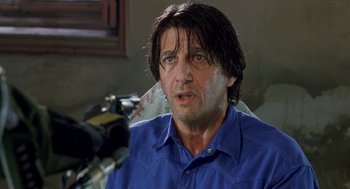 Movie still from “Kika” (1993), directed by Pedro Almodóvar – A person wearing a blue shirt; Close Up shot, Low angle